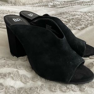 Black block heel mules.